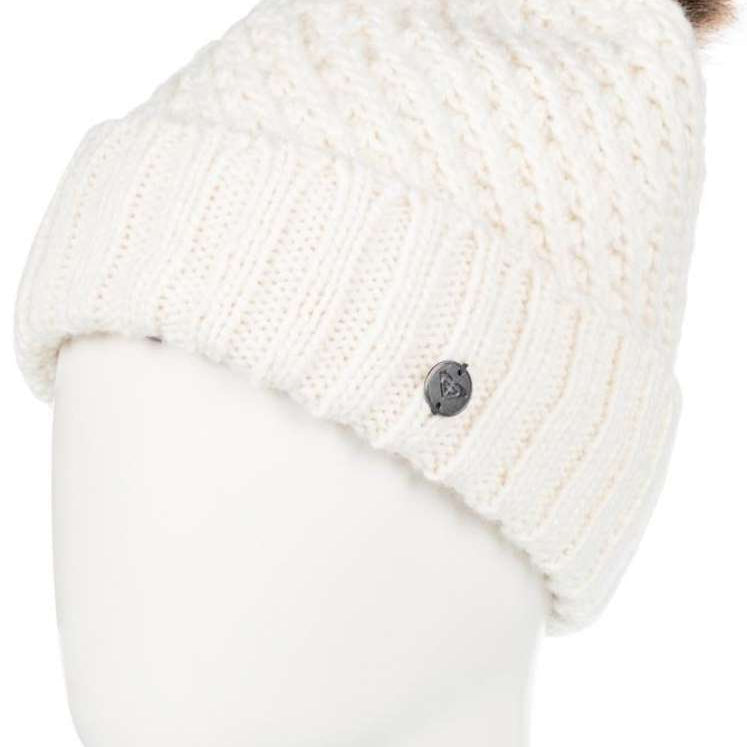Roxy Women's Blizzard Beanie 2024 - A cream-colored beanie with a brown faux fur pom-pom on top.