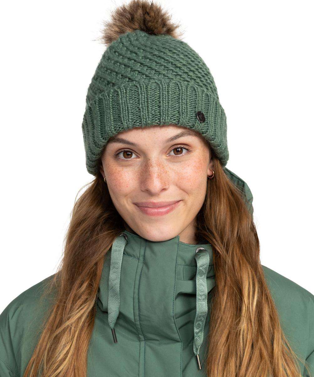 Roxy Women's Blizzard Beanie 2024 - Sage green beanie with a brown faux fur pom-pom on top.