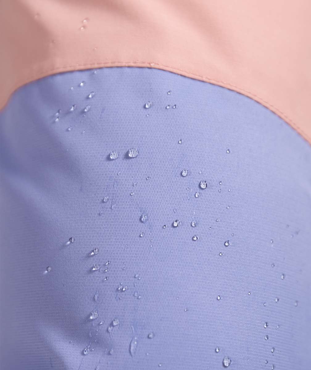 Roxy Women's Chloe Kim Bib Pant 2023 - White bib pants with a subtle floral pattern on the side of the leg.