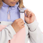 Roxy Women's Chloe Kim Bib Pant 2023 - A pair of snow pants with a black and white patterned design on the side, featuring a zippered pocket at the thigh.