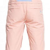 Roxy Women's Chloe Kim Bib Pant 2023 - Light pink bib pants with a subtle floral pattern on the side pockets and black hardware.