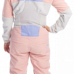 Roxy Women's Chloe Kim Bib Pant 2023 - Pastel pink snow pants with a subtle floral pattern on the straps and white accents around the waistband.