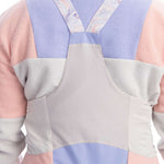 Roxy Women's Chloe Kim Bib Pant 2023 - A pair of snow pants with a subtle floral pattern in shades of pink and purple, featuring a white background.