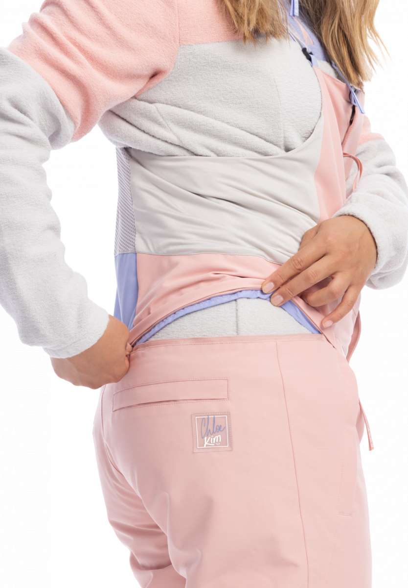 Roxy Women's Chloe Kim Bib Pant 2023 - Light blue bib with a white logo on the left thigh and black accents around the waistband.