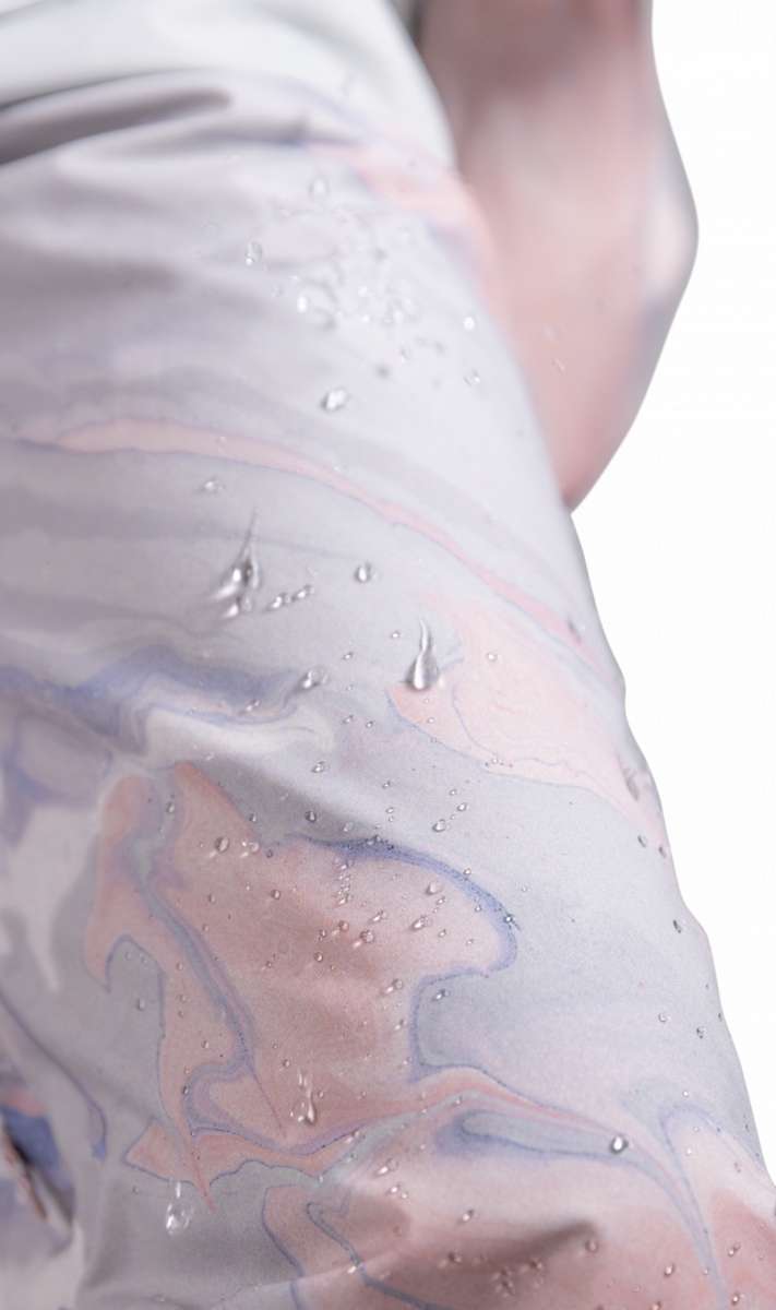 Roxy Women's Chloe Kim Insulated Pant 2023 - White snow pants with a subtle marbled pattern of blue and pink swirls.