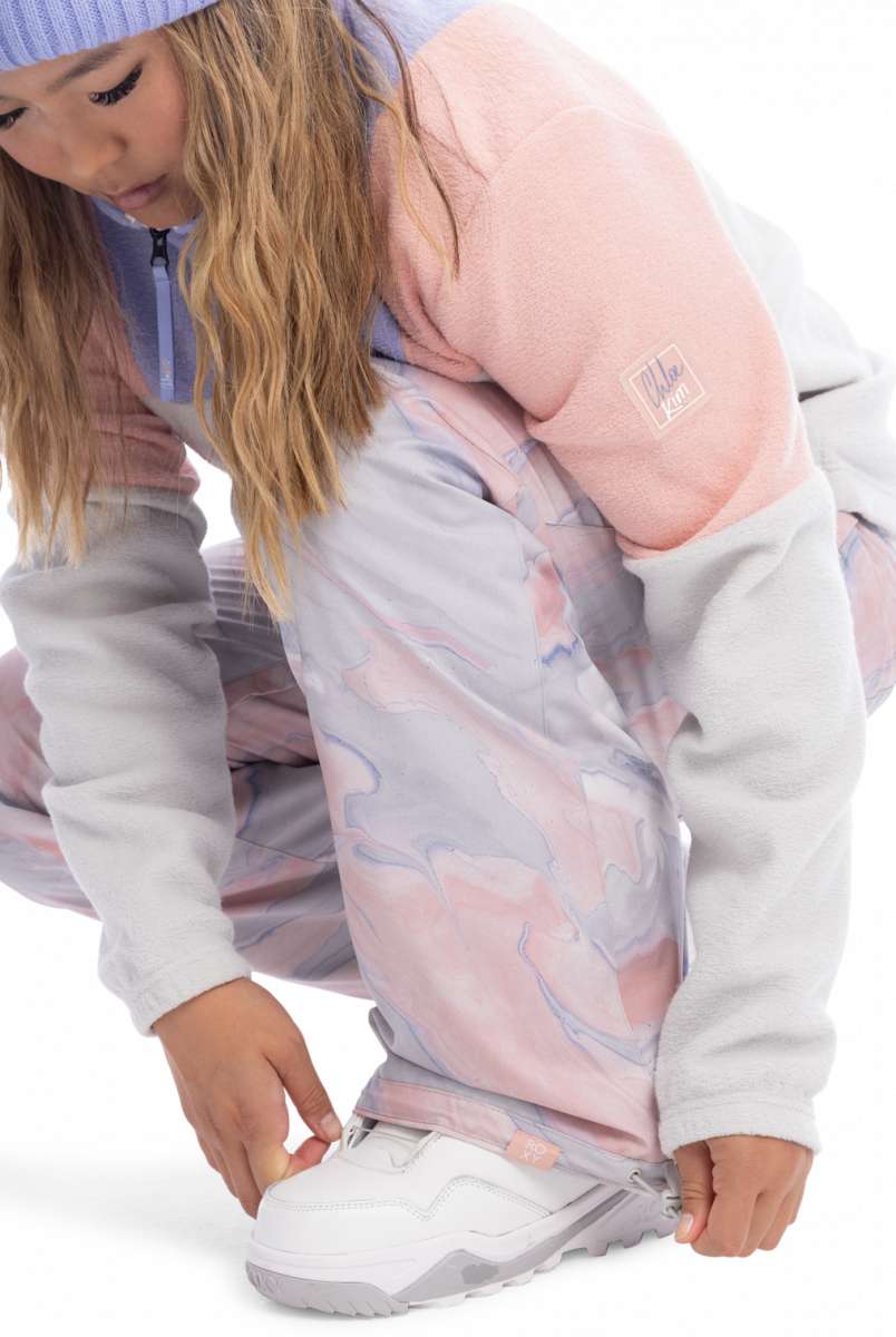 Roxy Women's Chloe Kim Insulated Pant 2023 - A pair of insulated snowboard pants with a marbled pattern in shades of pink and grey.