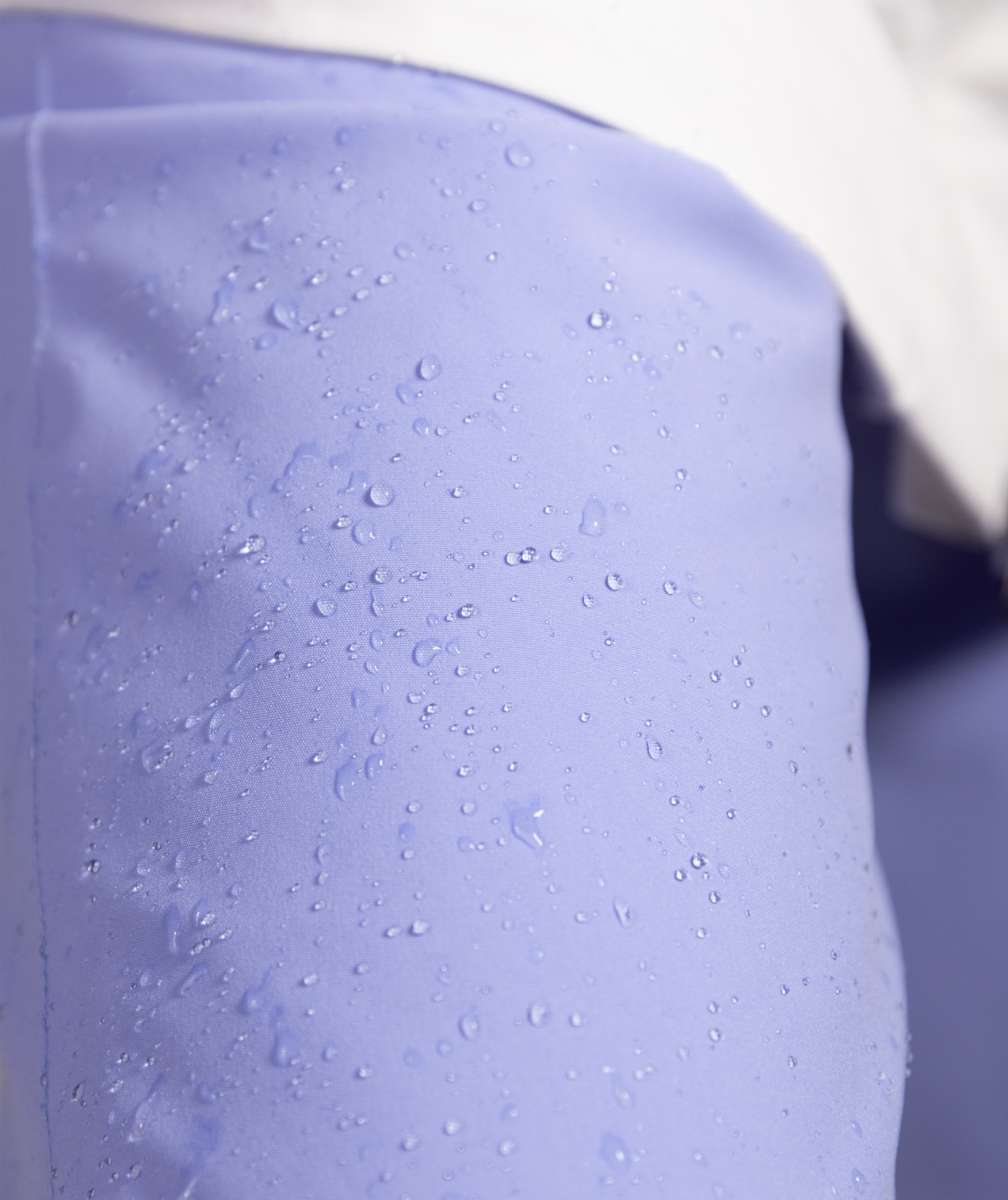 Roxy Women's Chloe Kim Insulated Pant 2023 - Water droplets on a pair of light purple snow pants with a subtle pattern.