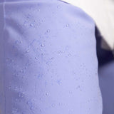 Roxy Women's Chloe Kim Insulated Pant 2023 - Water droplets on a pair of light purple snow pants with a subtle pattern.