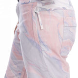 Roxy Women's Chloe Kim Insulated Pant 2023 - A pair of snow pants with a pink and grey marbled pattern, featuring a zippered pocket on the back.
