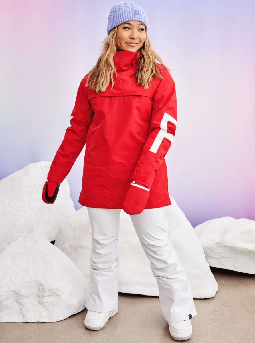 Roxy Women's Chloe Kim Overhead Jacket 2023 - A red jacket with a high collar and white lettering on the sleeve.