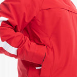 Roxy Women's Chloe Kim Overhead Jacket 2023 - A red jacket with a white stripe on the left sleeve and a hood.