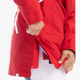 Roxy Women's Chloe Kim Overhead Jacket 2023 - A red jacket with a white stripe on the left sleeve and a zippered pocket on the right side.