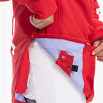 Roxy Women's Chloe Kim Overhead Jacket 2023 - A red jacket with white stripes on the left sleeve and a black zipper.