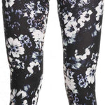 Roxy Women's Daybreak Bottom Base Layer 2023 - A pair of black leggings with a subtle floral pattern in white and light pink.