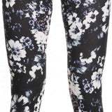 Roxy Women's Daybreak Bottom Base Layer 2023 - A pair of black leggings with a subtle floral pattern in white and light pink.