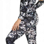 Roxy Women's Daybreak Bottom Base Layer 2023 - A black base layer with a white floral pattern and blue accents.