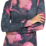Roxy Women's Daybreak Top 2024 - A pink, long-sleeved top with a crew neck and abstract floral pattern on a black background.