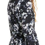 Roxy Women's Daybreak Top Base Layer 2023 - A black top with a white floral pattern and blue accents.
