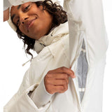 Roxy Women's Dusk Warmlink Insulated Jacket 2024 - A cream-colored jacket with a hood, featuring a zippered front and two side pockets.