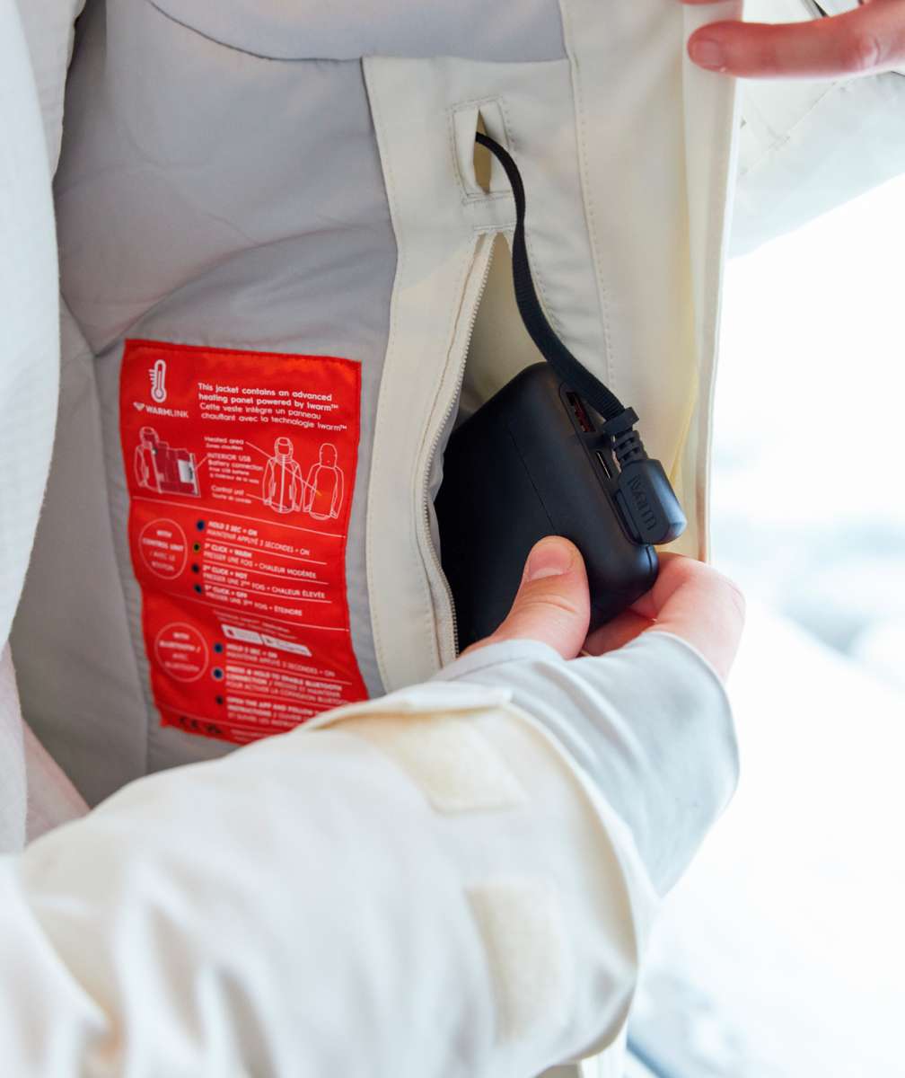 Roxy Women's Dusk Warmlink Insulated Jacket 2024 - A white jacket with a red label on the inside lining, featuring a zipper and a black cord attached to it.