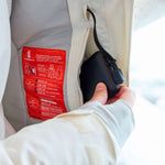 Roxy Women's Dusk Warmlink Insulated Jacket 2024 - A white jacket with a red label on the inside lining, featuring a zipper and a black cord attached to it.