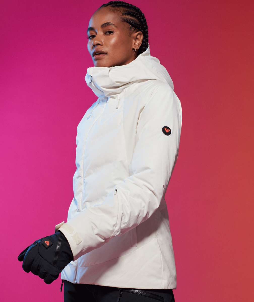 Roxy Women's Dusk Warmlink Insulated Jacket 2024 - A white jacket with a hood and zippered pockets, featuring a small black logo on the left sleeve.