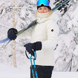 Roxy Women's Dusk Warmland Insulated Jacket - A black jacket with a white logo on the left chest and a hood, worn by a model posing in front of snowy trees.