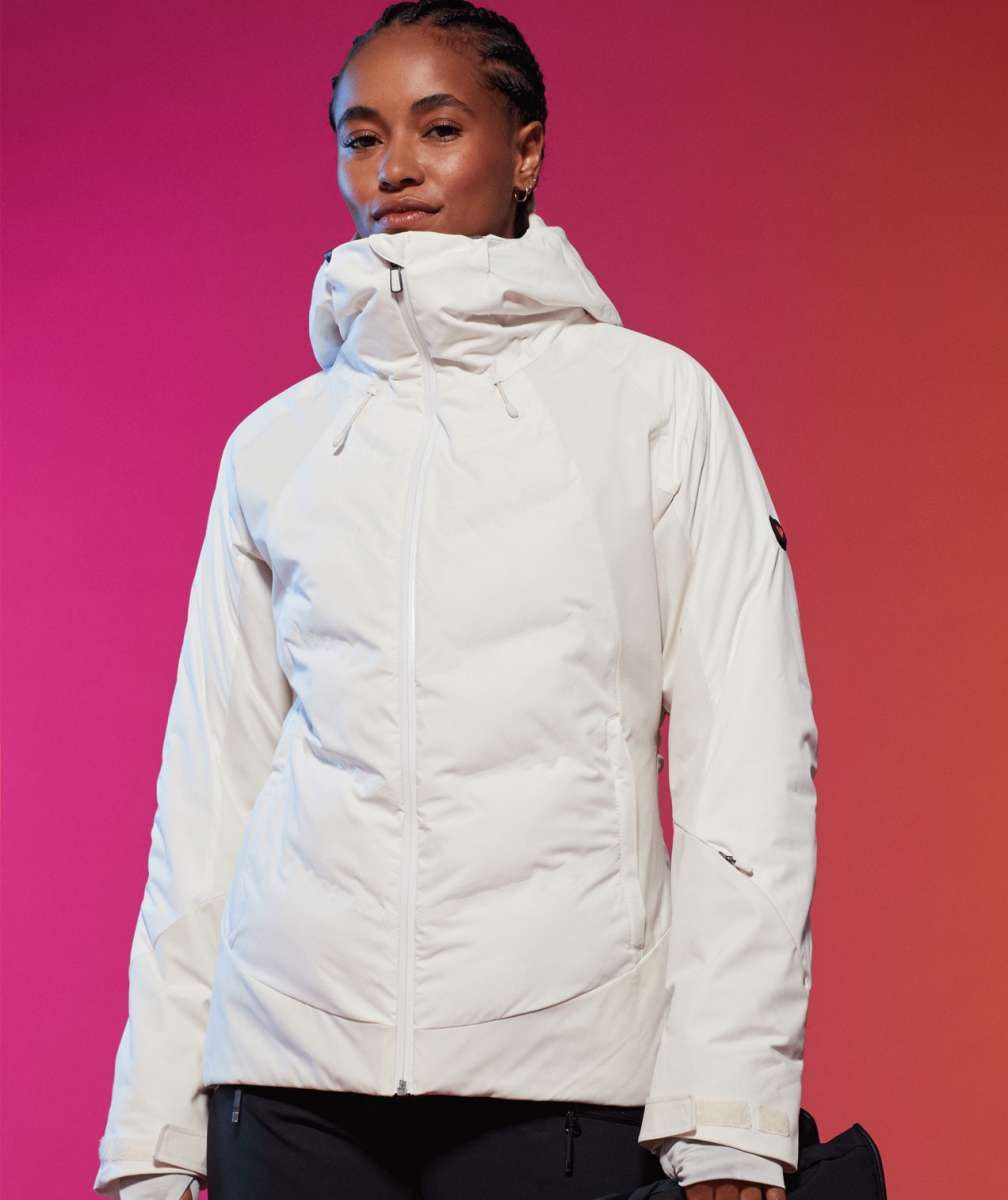 Roxy Women's Dusk Warmlink Insulated Jacket 2024 - A white jacket with a hood, featuring black accents on the sleeves and a zippered front.