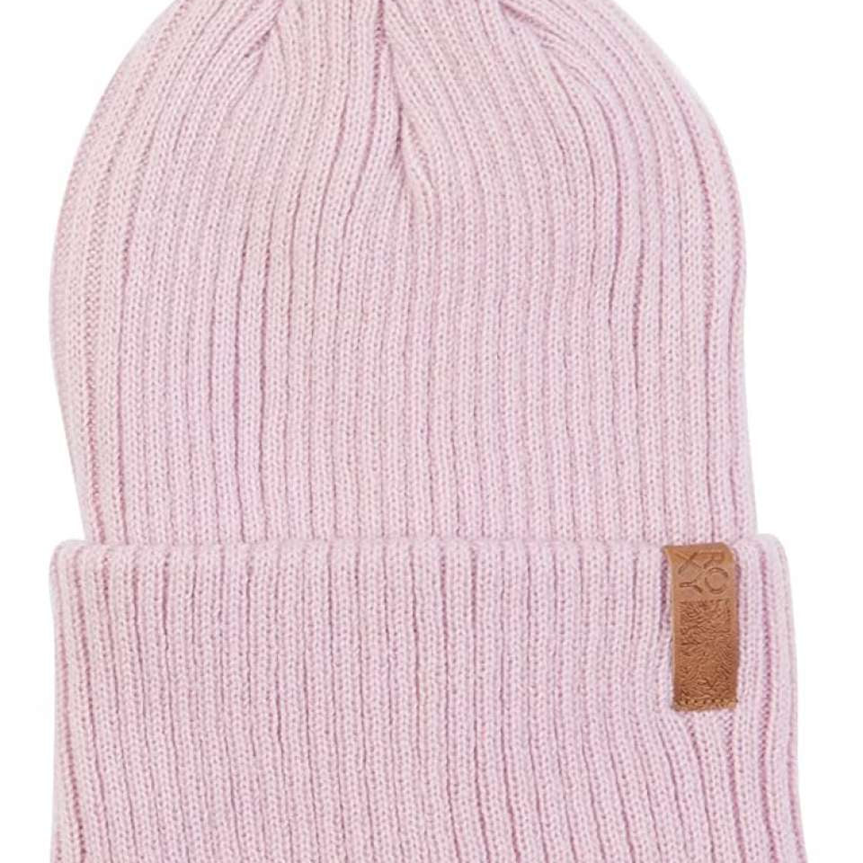 Roxy Women's Dynabeat Beanie 2022 - A light pink beanie with a ribbed texture and a small brown leather tag on the front.