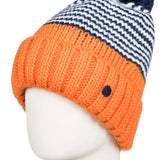 Roxy Women's Frozenfall Beanie 2022 - A navy and white houndstooth patterned beanie with a large pom-pom on top.