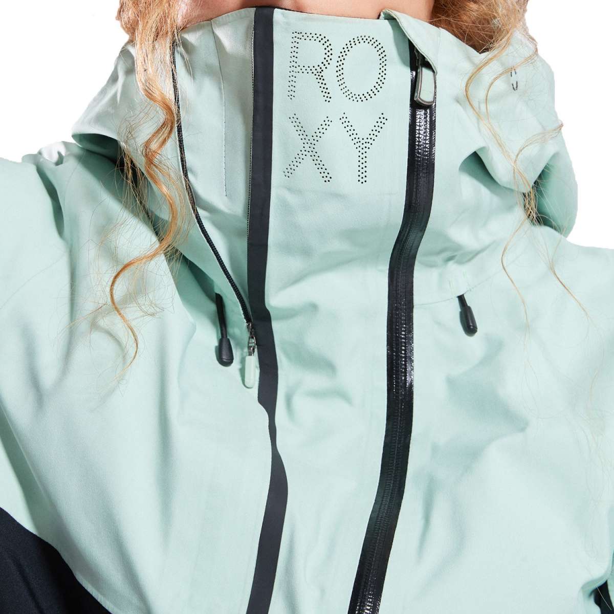 Roxy Women's GORE-TEX Stretch Purelines Jacket 2024 - A light blue jacket with a hood and black zipper, featuring the word "ROXY" in dotted letters on the back of the hood.