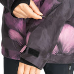 Roxy Women's GORE-TEX Glade Insulated Jacket 2024 - A purple and black jacket with a subtle floral pattern, featuring a zipper closure on the front.