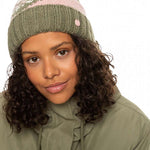 Roxy Women's Hateya Beanie 2023 - A green beanie with a pink stripe and white snowflake pattern on top.