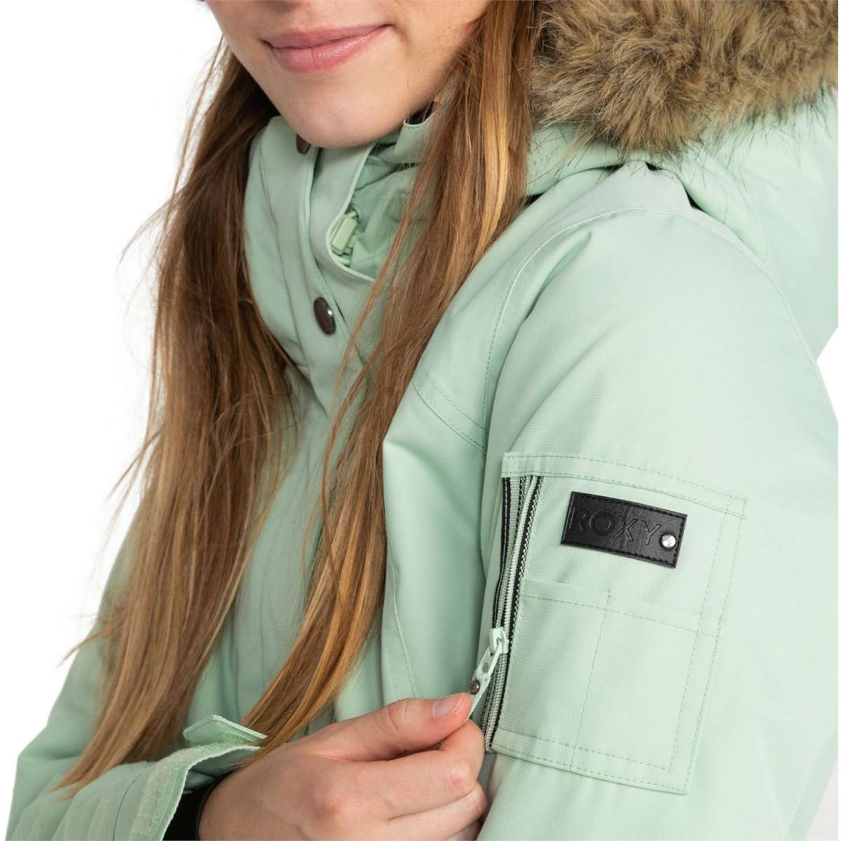 Roxy Women's Meade Insulated Jacket 2024 - A mint green jacket with a fur-lined hood and silver snap buttons.