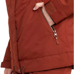 Roxy Women's Meade Insulated Jacket - A rust-colored jacket with a zippered pocket on the left side and a brown zipper pull.