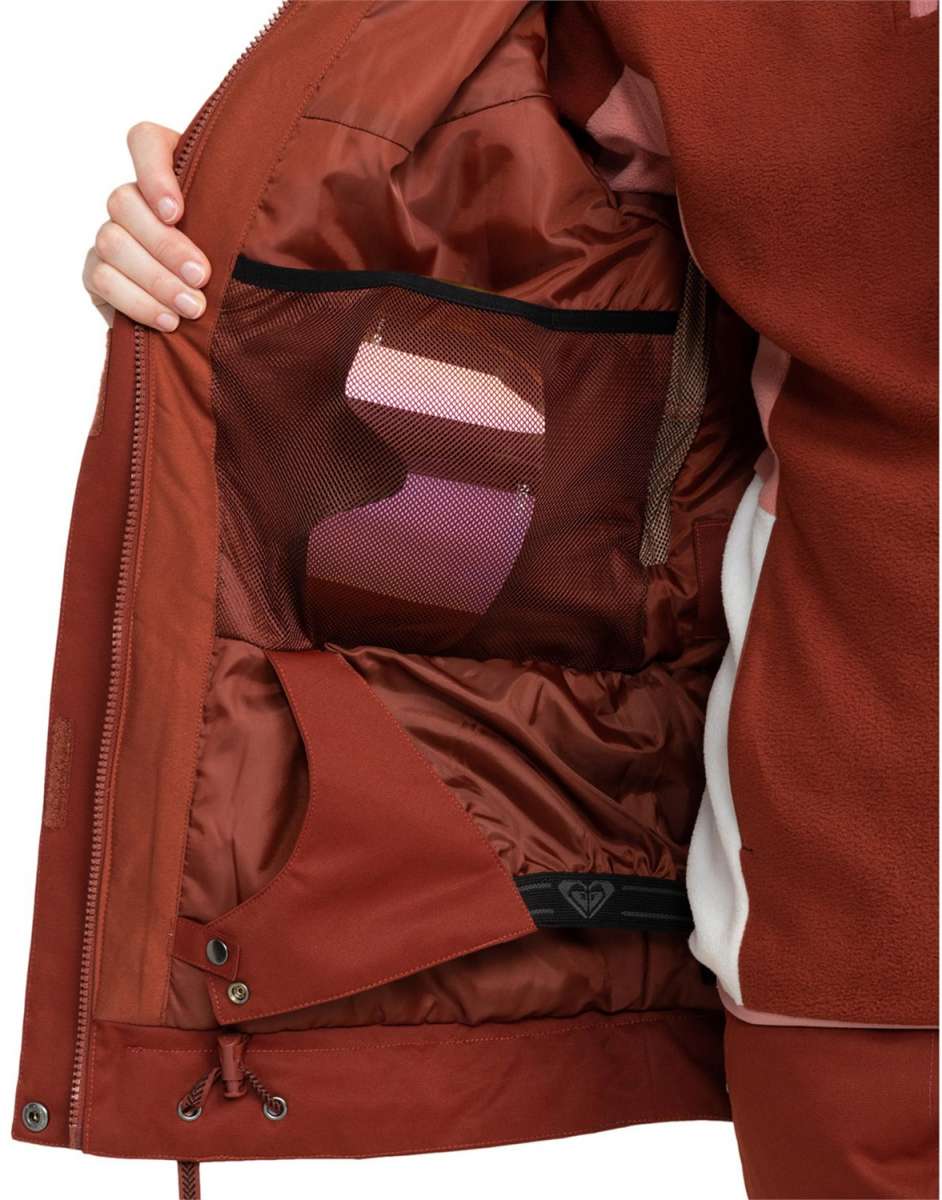 Roxy Women's Meade Insulated Jacket - A rust-colored jacket with a zippered chest pocket and two side pockets, featuring a hood and adjustable cuffs.