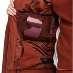 Roxy Women's Meade Insulated Jacket - A rust-colored jacket with a zippered chest pocket and two side pockets, featuring a hood and adjustable cuffs.