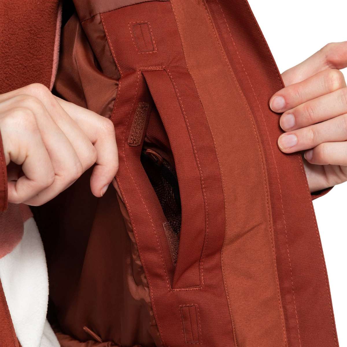 Roxy Women's Meade Insulated Jacket 2024 - A rust-colored jacket with a zippered chest pocket and two side pockets, featuring a brown logo on the left chest.