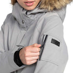 Roxy Women's Meade Insulated Jacket - A light gray jacket with a fur-lined hood and black zipper.