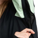 Roxy Women's Peakside Insulated Jacket 2024 - A black and mint green jacket with a zippered front, worn by a model from behind.