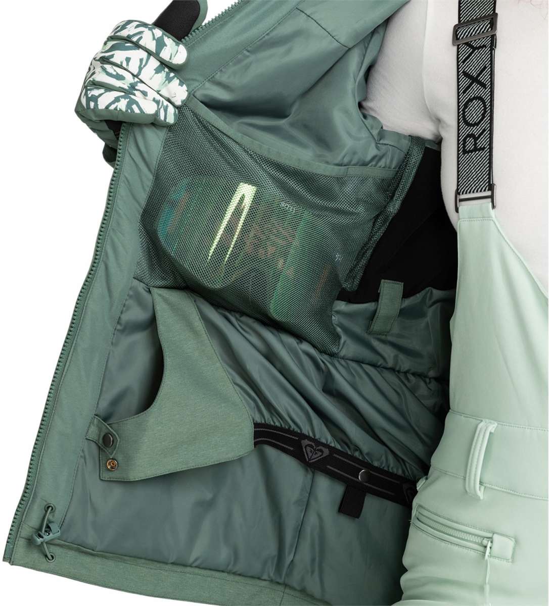 Roxy Women's Presence Insulated Parka Jacket 2024 - A dark green parka jacket with a hood and zippered pockets.