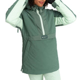 Roxy Women's Radiant Lines Pullover Jacket 2024 - A dark green jacket with a white stripe down the center and a hood, worn by a model with curly hair.