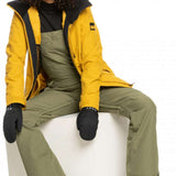 Roxy Women's Rideout Insulated Bib Pant 2023 - A pair of olive green snow pants with adjustable straps and a zippered pocket on the side.