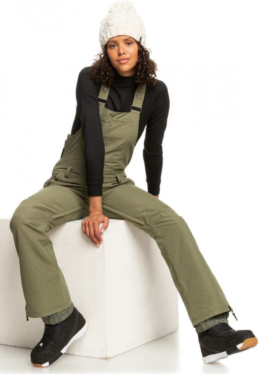 Roxy Women's Rideout Insulated Bib Pant 2023 - Olive green bib pants with adjustable straps and zippered pockets.