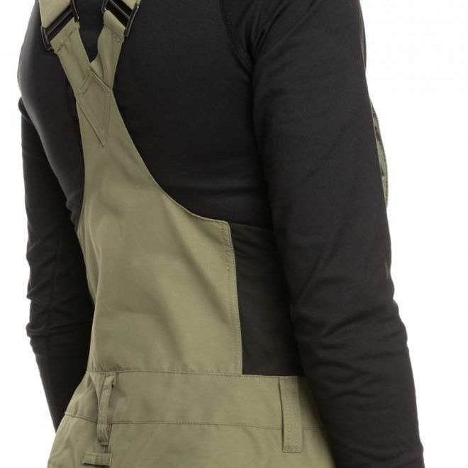 Roxy Women's Rideout Insulated Bib Pant 2023 - A pair of olive green bib pants with adjustable straps and a zippered fly.
