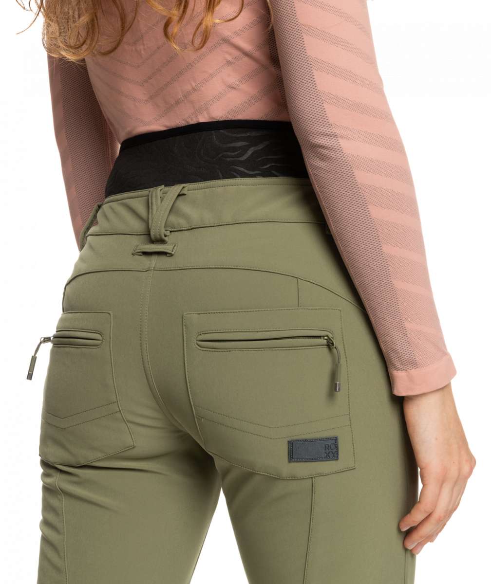 Roxy Women's Rising High Pant 2023 - A pair of olive green pants with a zippered pocket on the back right side.