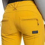 Roxy Women's Rising High Pant 2023 - A pair of yellow ski pants with zippered pockets and a black waistband.