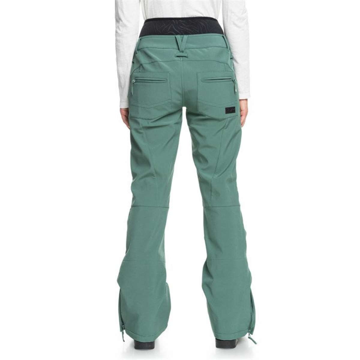 Roxy Women's Rising High Pant 2024 - A pair of women's snow pants in a light green color with zippered pockets and adjustable cuffs.
