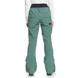 Roxy Women's Rising High Pant 2024 - A pair of women's snow pants in a light green color with zippered pockets and adjustable cuffs.