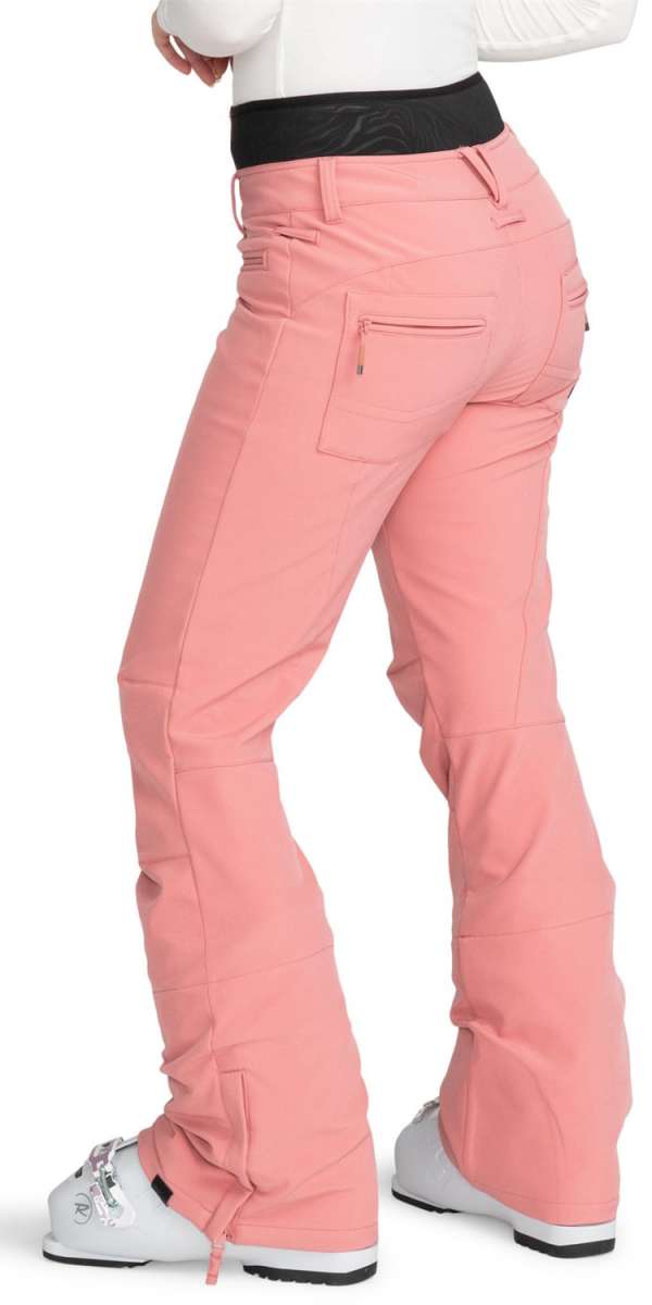Roxy Women's Rising High Pant 2024 - A pair of pink snow pants with a black waistband and zippered pockets.